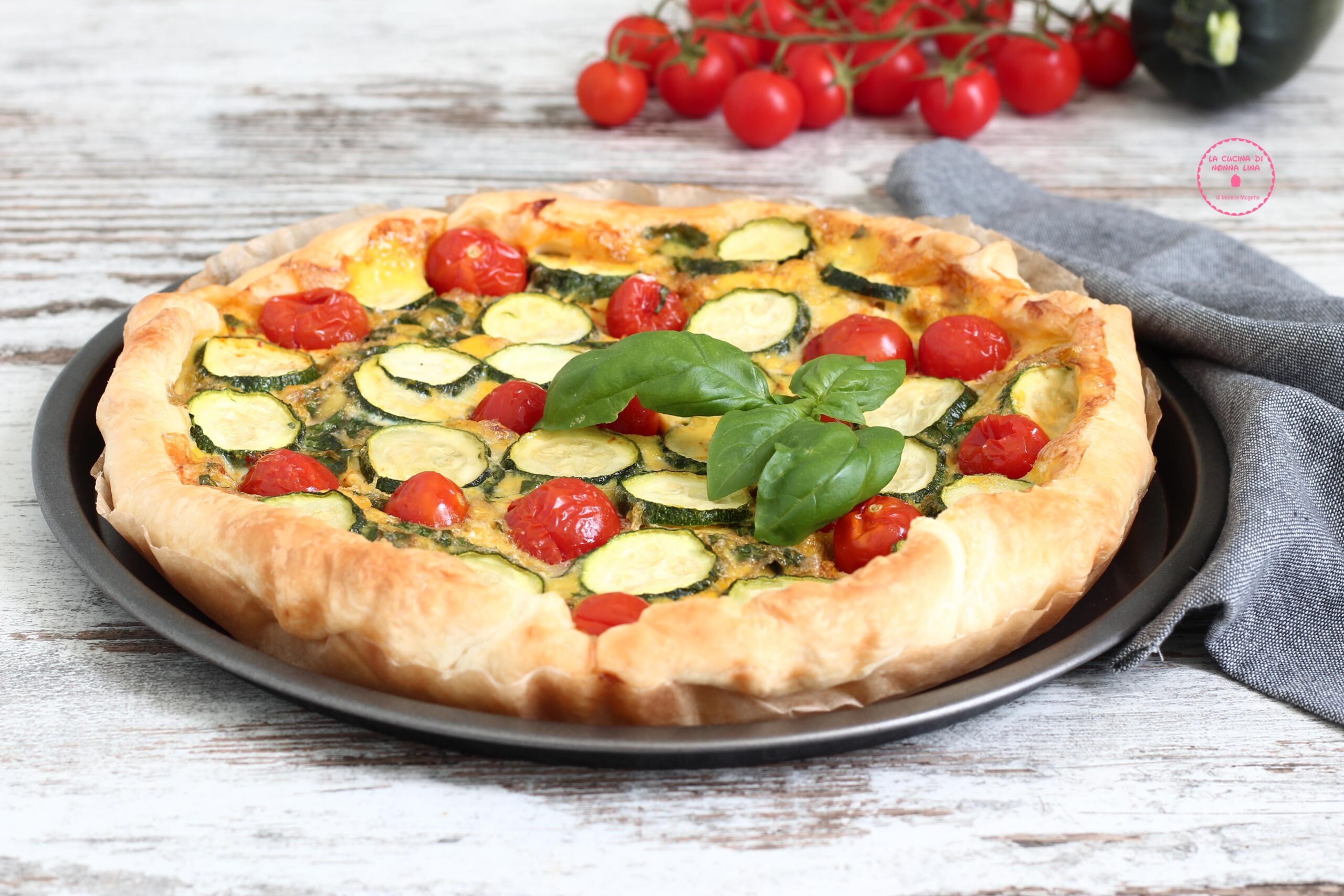 Summer savory pie with zucchini and cherry tomatoes