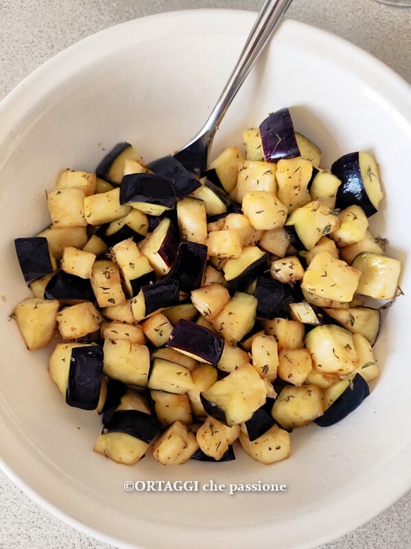 eggplants in air fryer seasoned with oil and spices