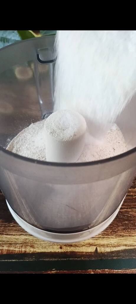 Combining flour, sugar, and butter in the food processor