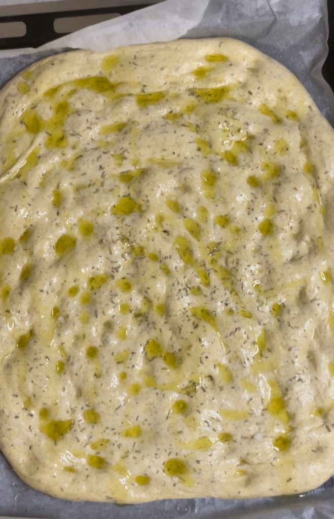 finishing before baking the focaccia