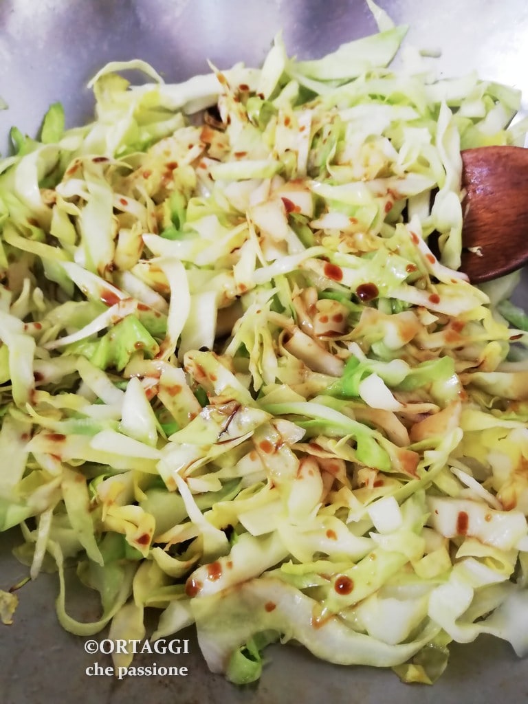 cabbage in wok pan