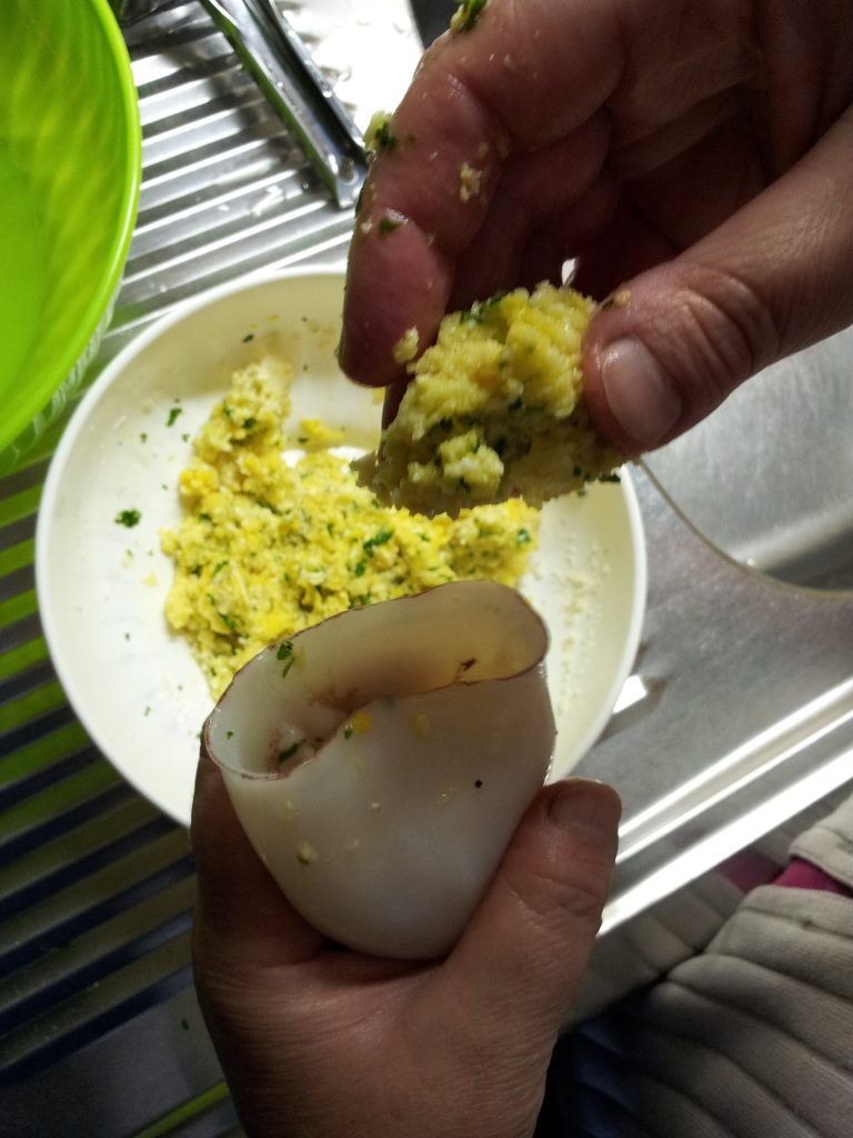 Stuffing and sealing the squid