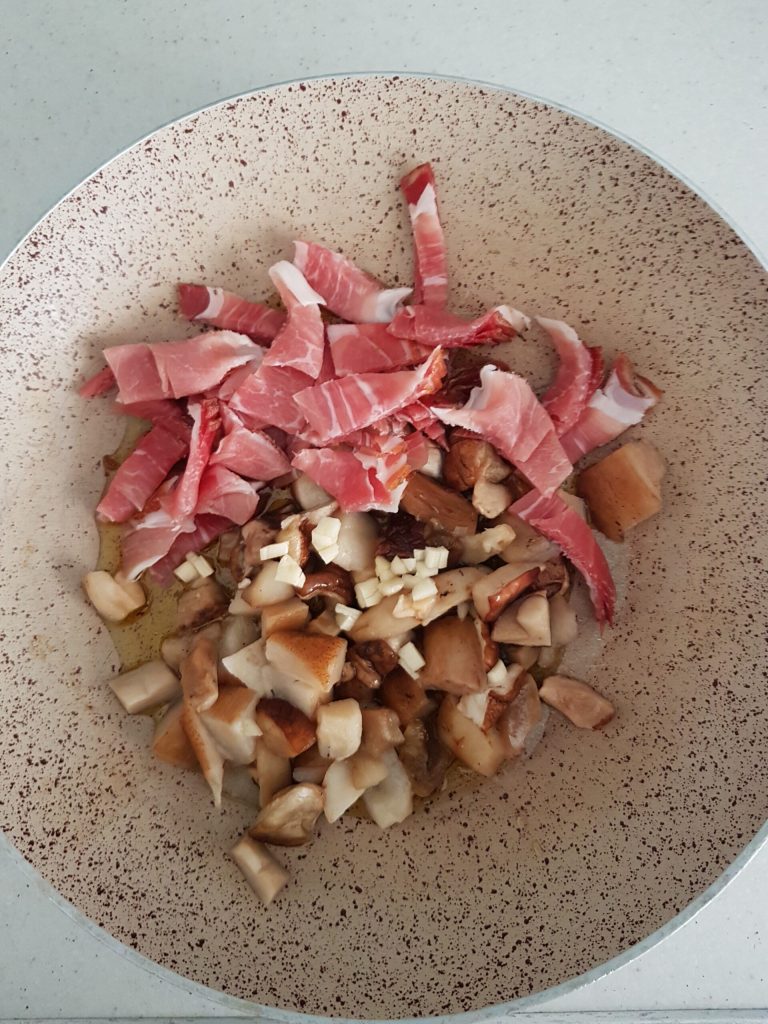 savory pie with ricotta, mushrooms, and speck