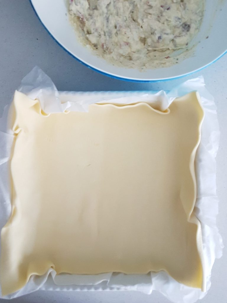 savory pie with ricotta, mushrooms, and speck