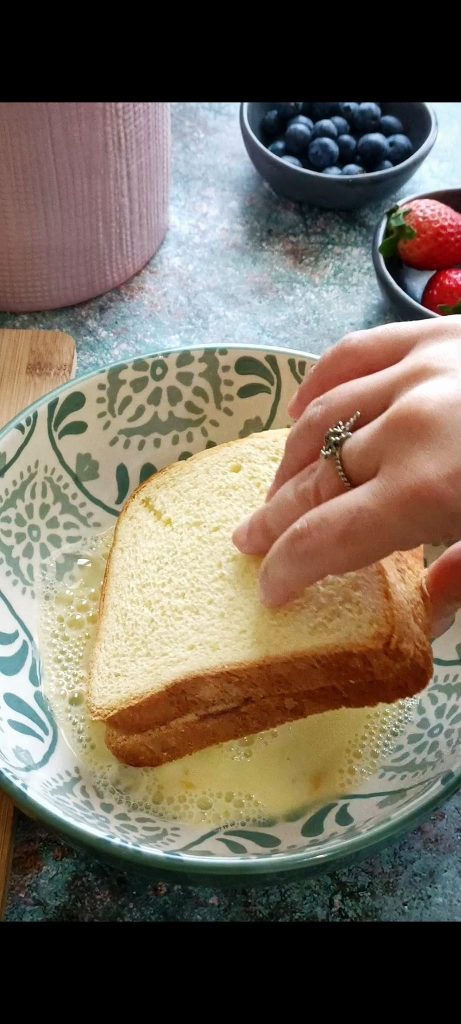 Dip the slices of bread into the egg