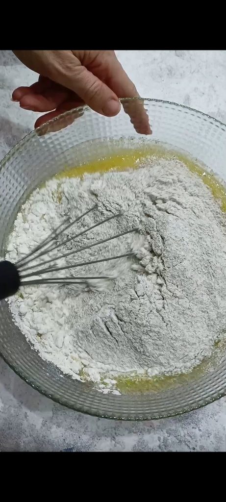 Combine the flours with the baking powder