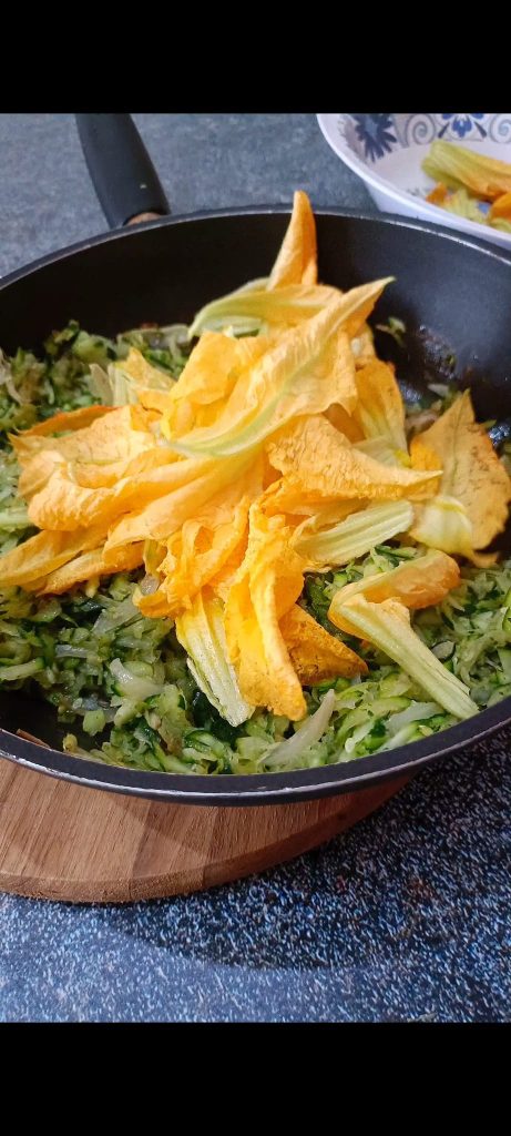 We add the squash blossoms