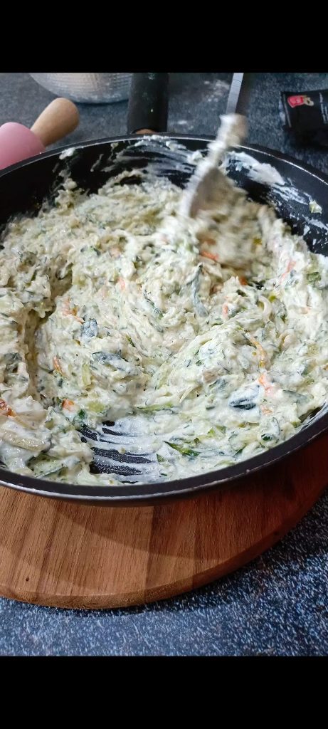 We also add the spreadable cheese and the grated parmesan