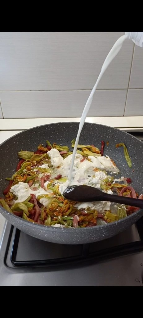 Add the burrata and a splash of milk