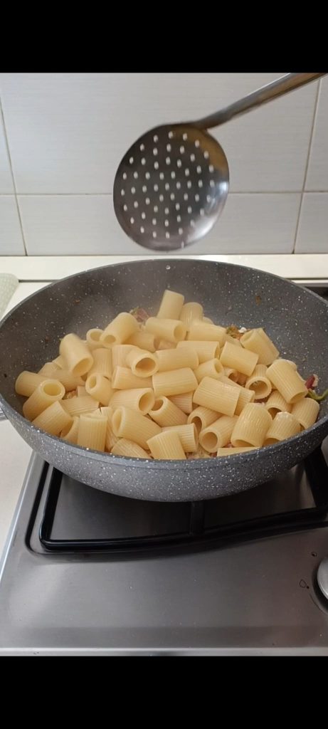 Drain the pasta and toss in the pan