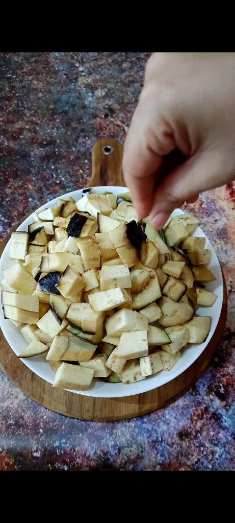 Dice the eggplants and sprinkle with salt