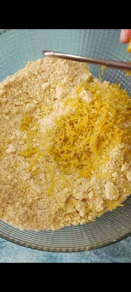 Add grated lemon zest, starch, and baking powder