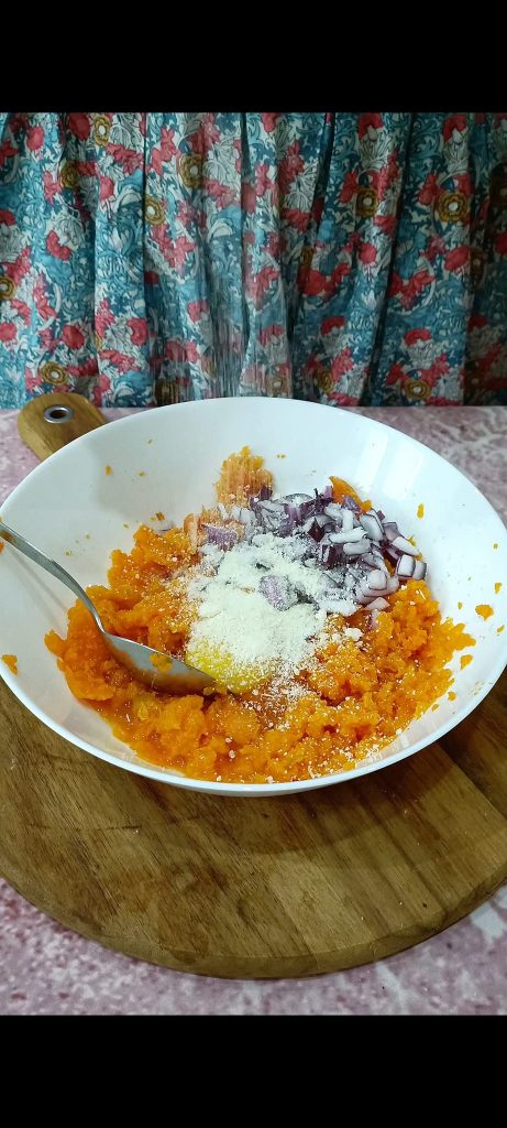 Adding egg and grated Parmesan