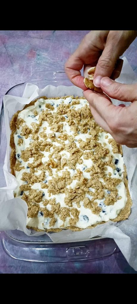 Adding remaining dough crumbs and walnuts