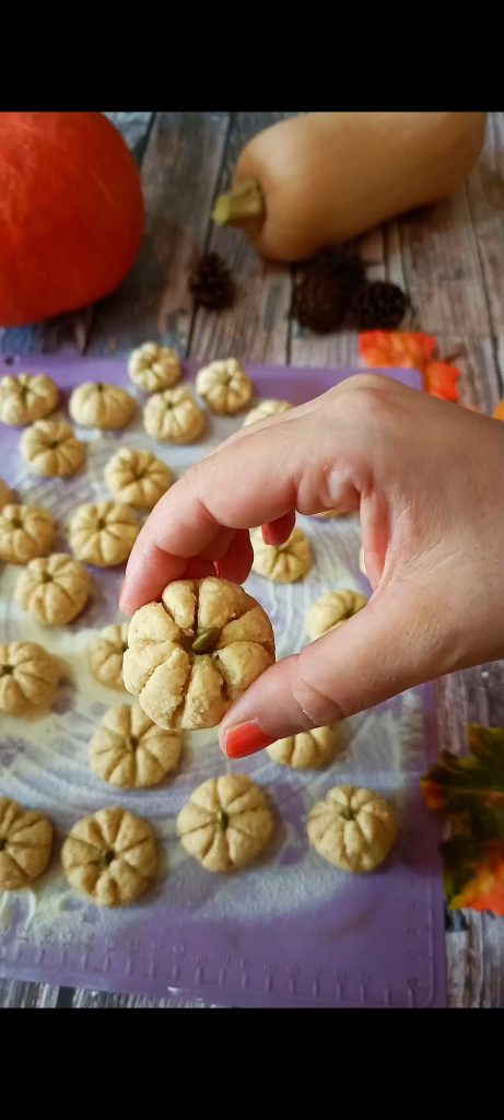 Place a pumpkin seed on each gnocchi