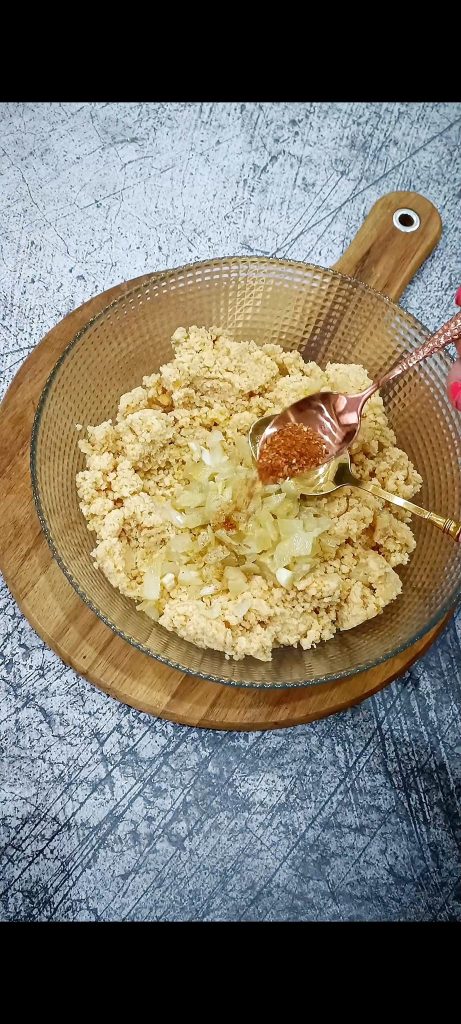Add onions and spices to the lentil and couscous mixture