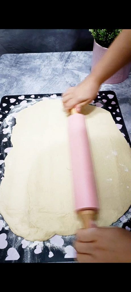 Roll out the dough to form a large rectangle