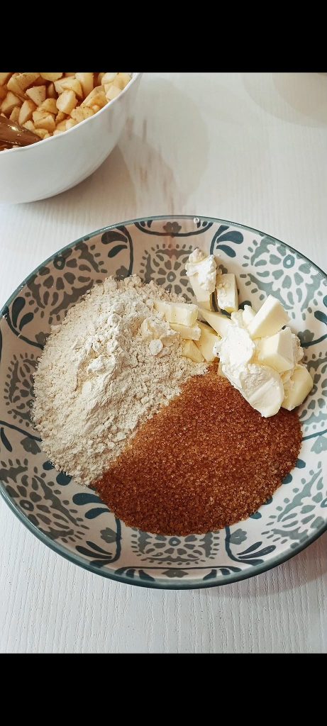 Prepare the crumble with flour, brown sugar, butter, and cinnamon