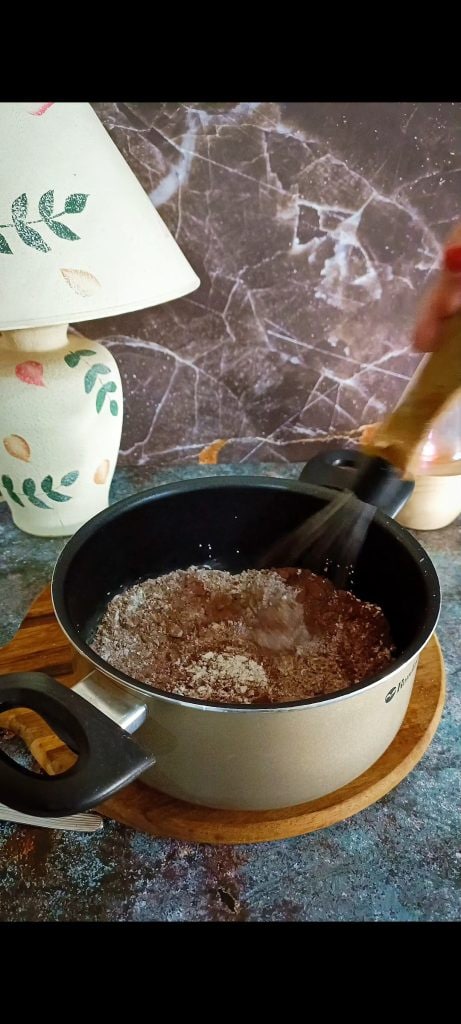 Pour cocoa, sugar, and starch into a pot