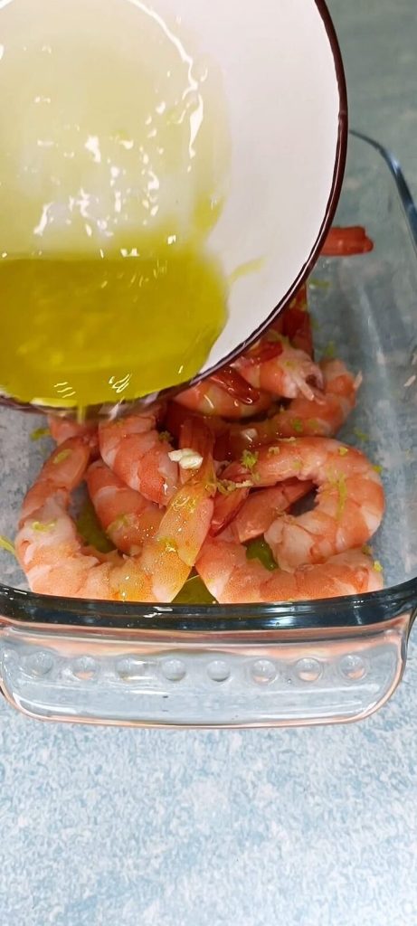 Pouring the emulsion over the shrimp
