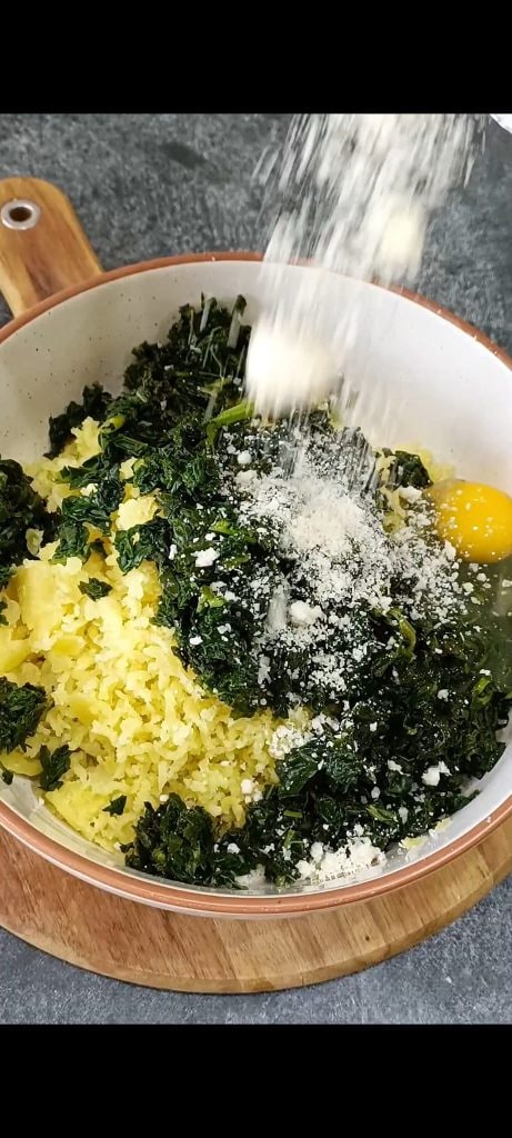 Adding all other ingredients to the potatoes