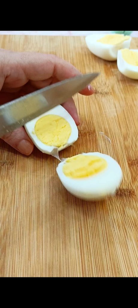 Cutting the eggs in half