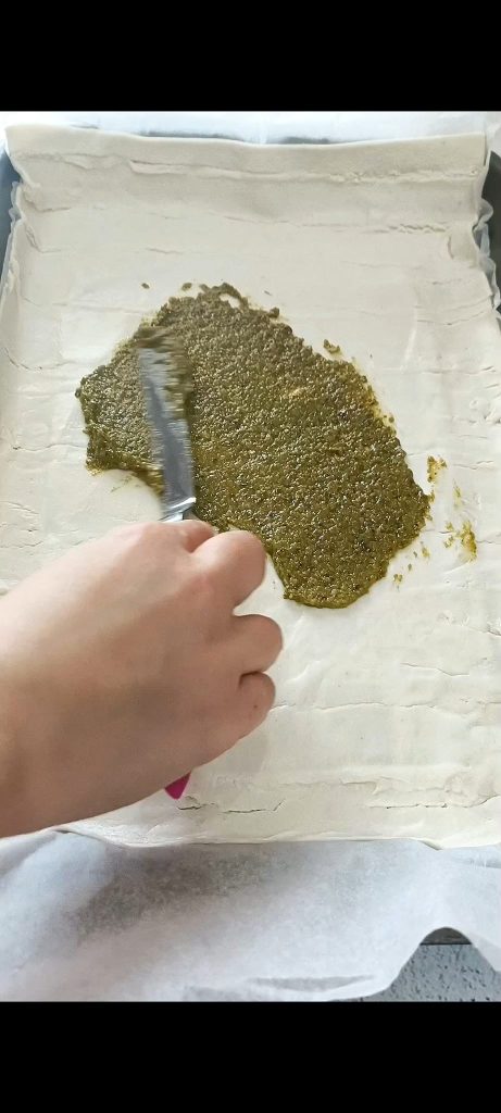 We spread the basil pesto on the puff pastry