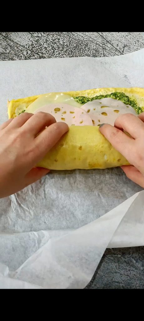 Rolling up the omelet