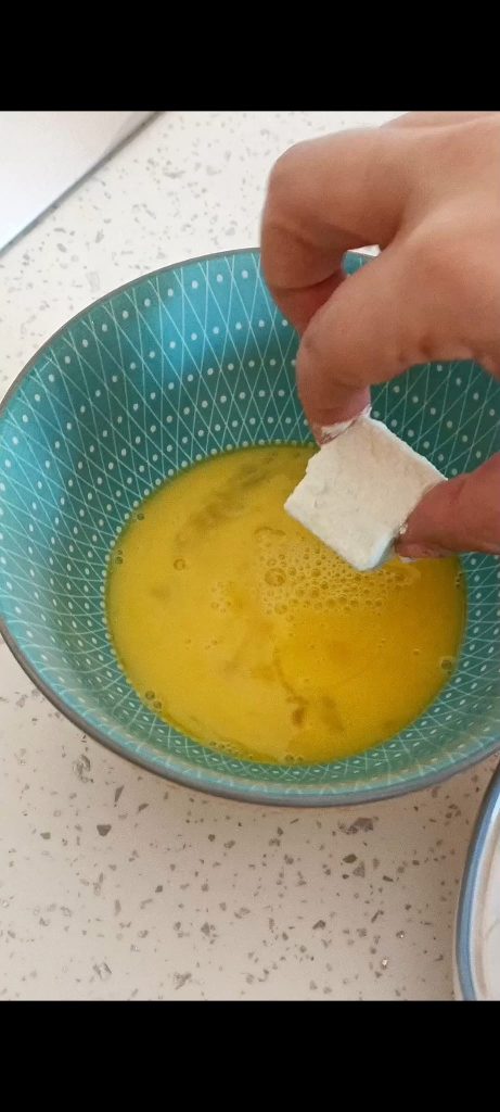 Then in beaten egg