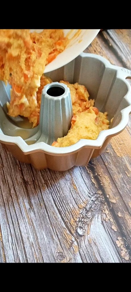 Pour half of the apricot batter at the bottom of the mold