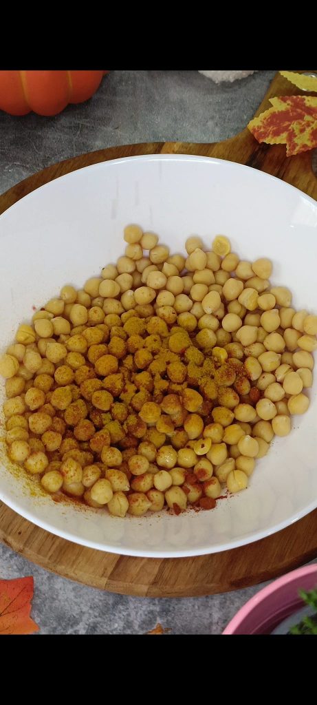 We season the chickpeas with oil, spices, and herbs