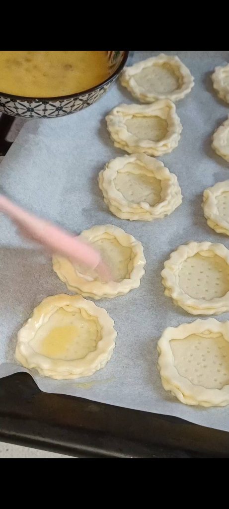 Brush them with a beaten egg