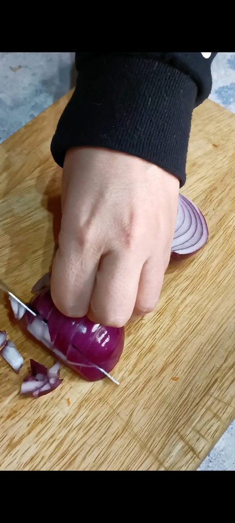 Chopping the red onion