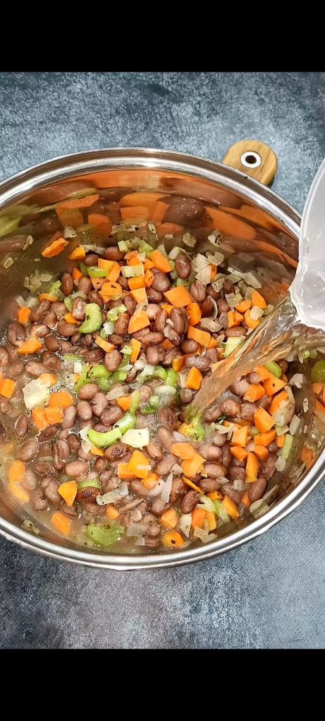 Add beans and broth