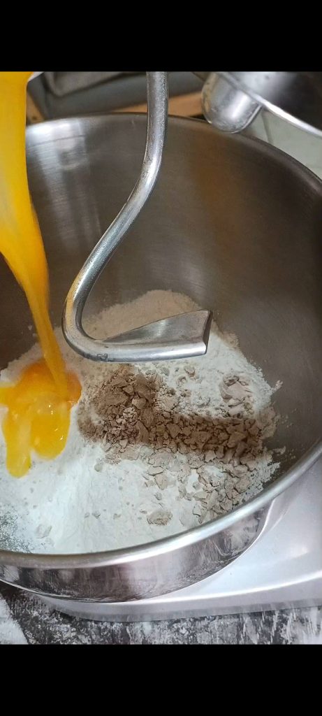 Combining flour, yeast, eggs
