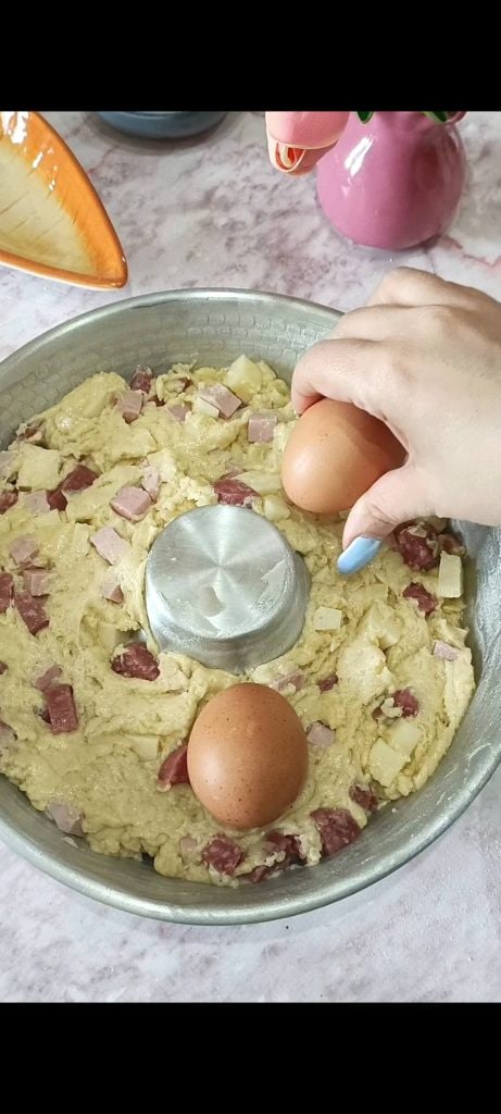 Pour the batter into the mold and place the eggs