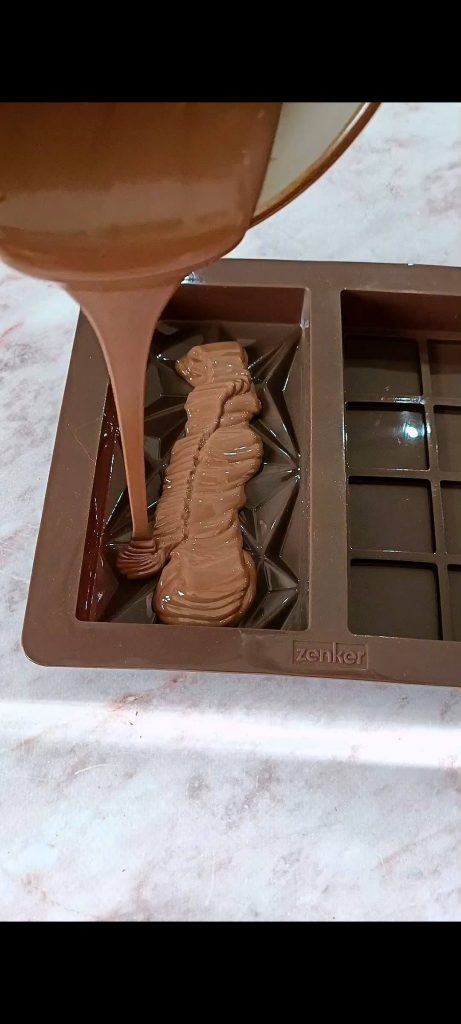 Pouring chocolate into molds