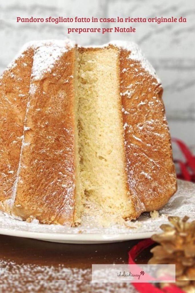 Homemade layered Pandoro with a soft interior, served on a white plate with powdered sugar and Christmas decorations