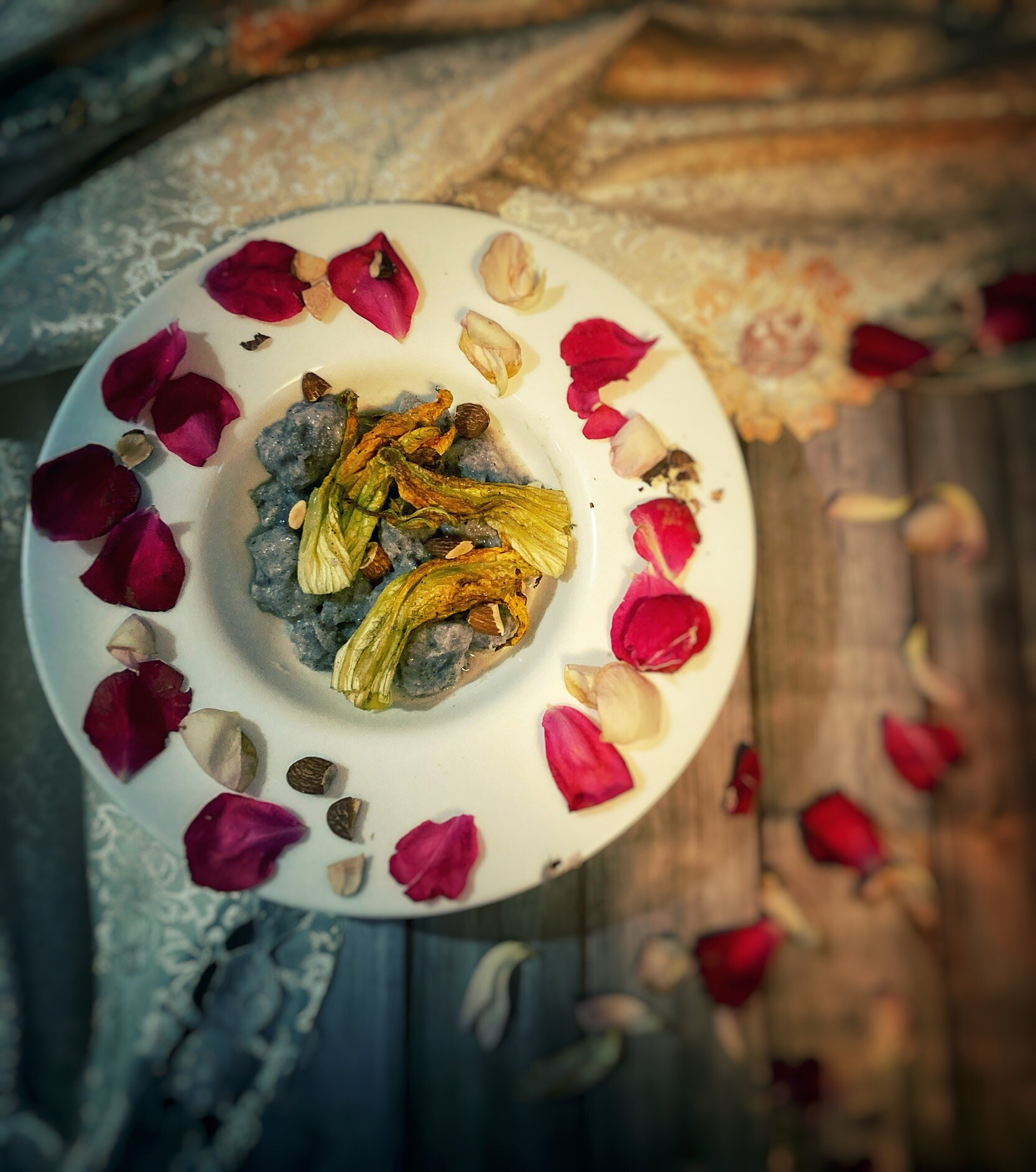 Purple Potato Gnocchi with Pecorino Cream, Zucchini Flowers and Toasted Almonds