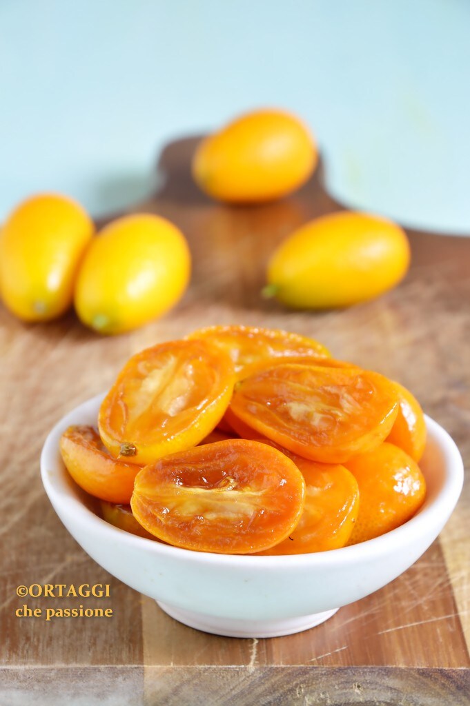 Sweet and sour caramelized kumquats in a pan