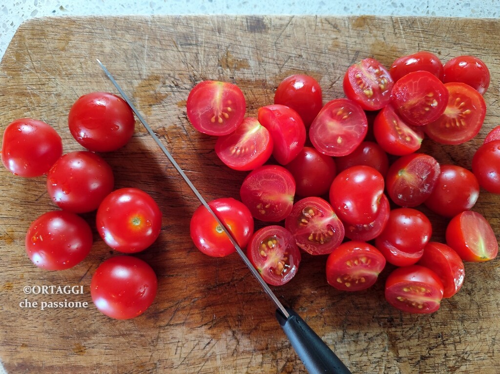 cutting cherry tomatoes in half