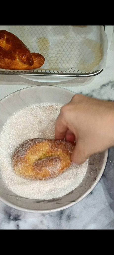 Brush with butter and roll in sugar and cinnamon