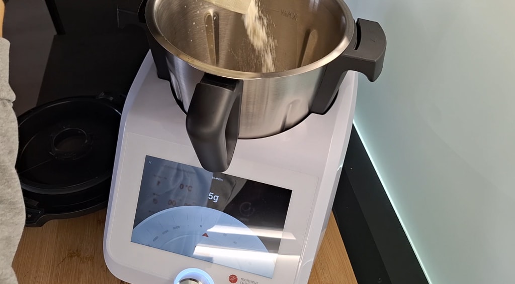 Adding the flour to the Monsieur Cuisine Smart