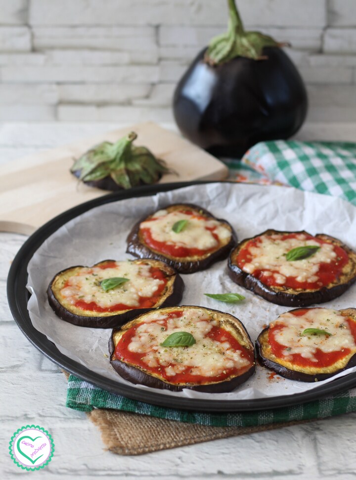Eggplant mini pizzas with tomato and mozzarella