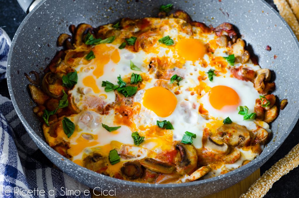 Eggs with mushrooms in a pan