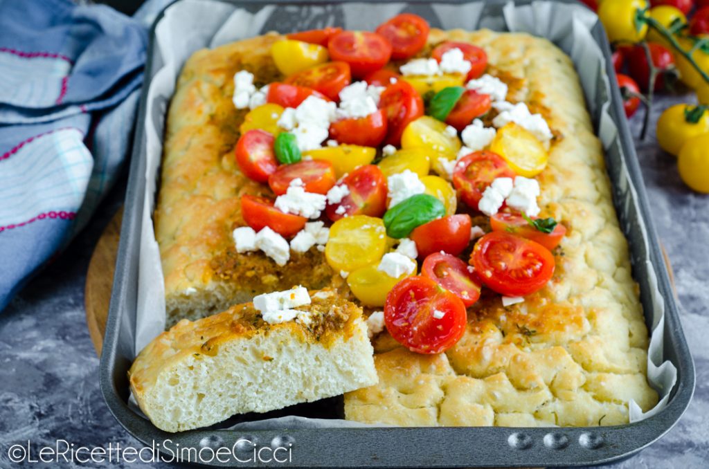 Focaccia with red pesto, cherry tomatoes, and feta