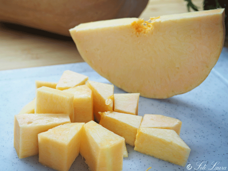 Pumpkin pieces on the cutting board ready to be frozen