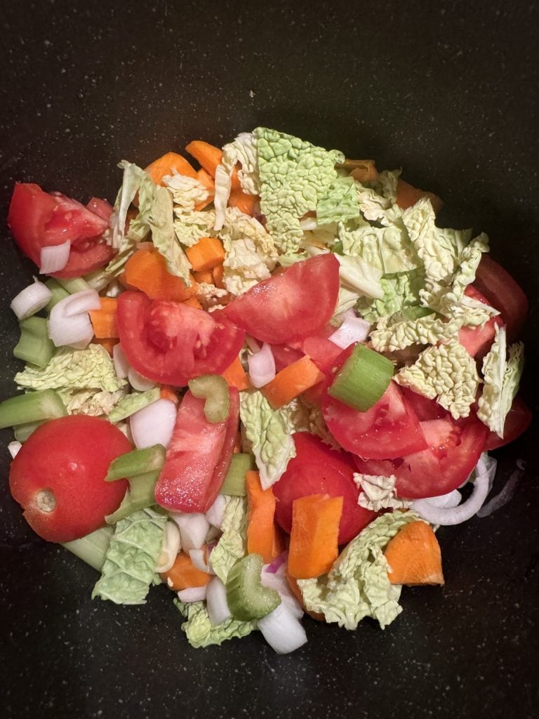 combining vegetables in the pot for Tuscan ribollita