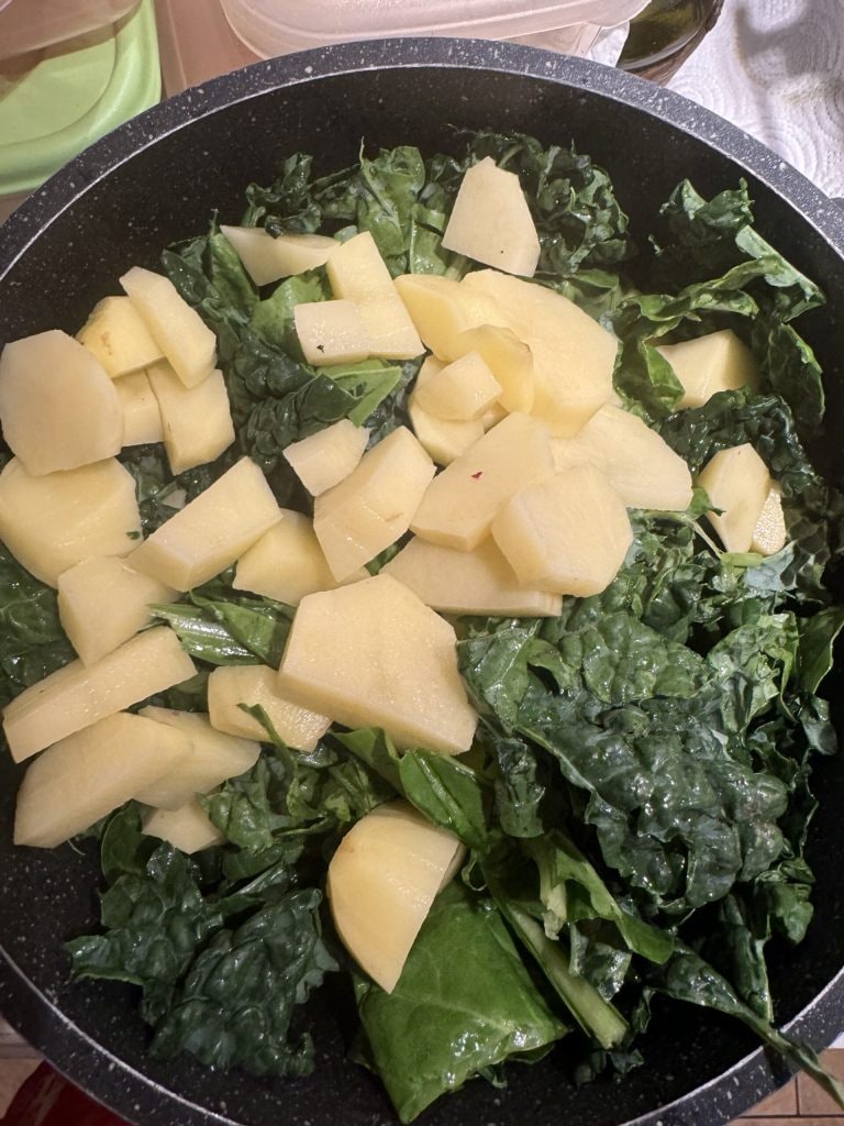 add kale and potatoes to the Tuscan ribollita