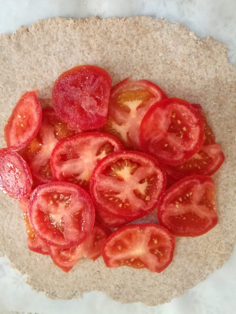 Place the tomatoes on top